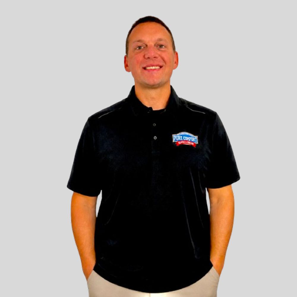 Gene, owner of Pure Comfort Heating & Cooling in Streamwood, Illinois, wearing the company polo