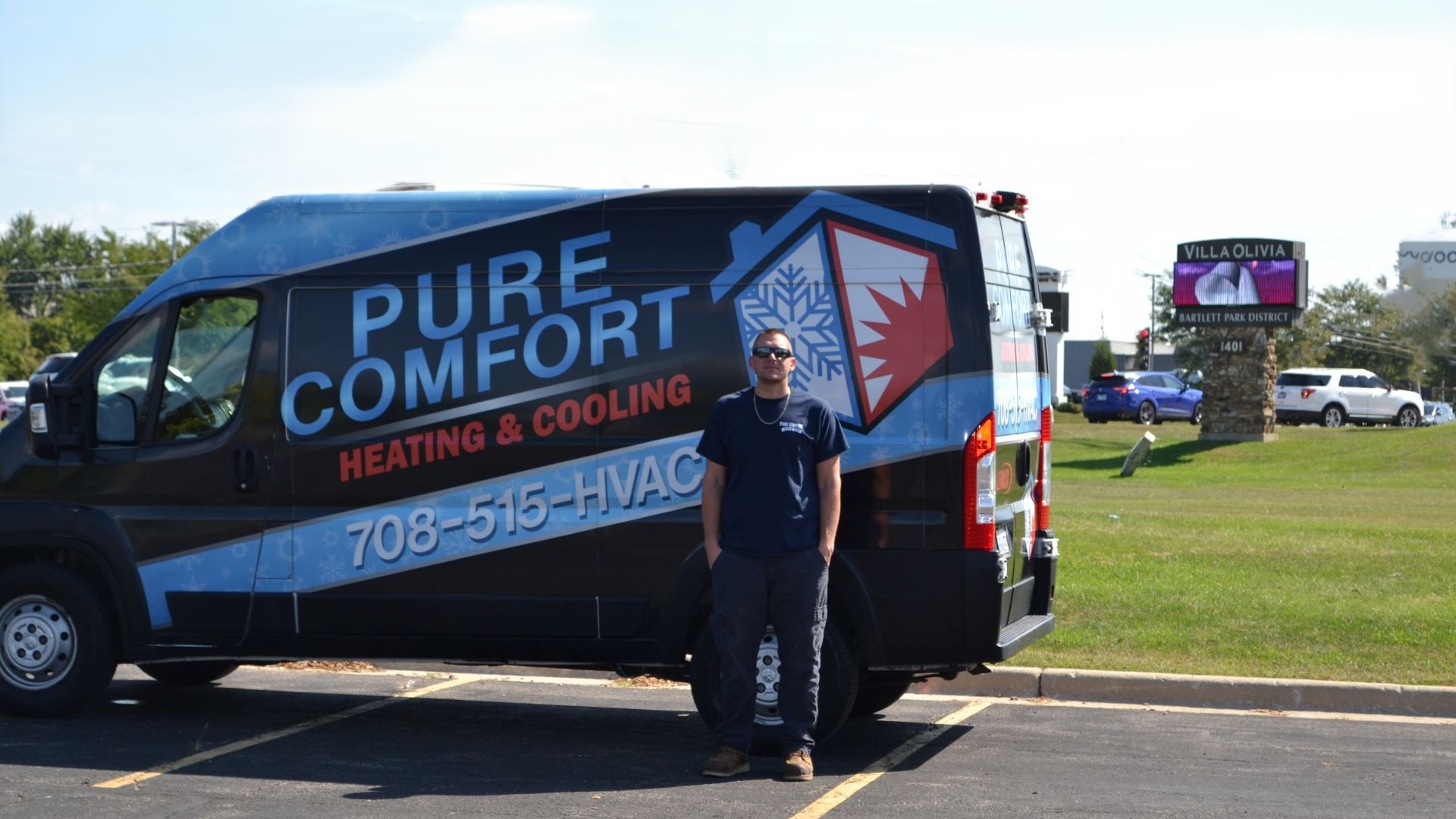 Gene infront of a service van