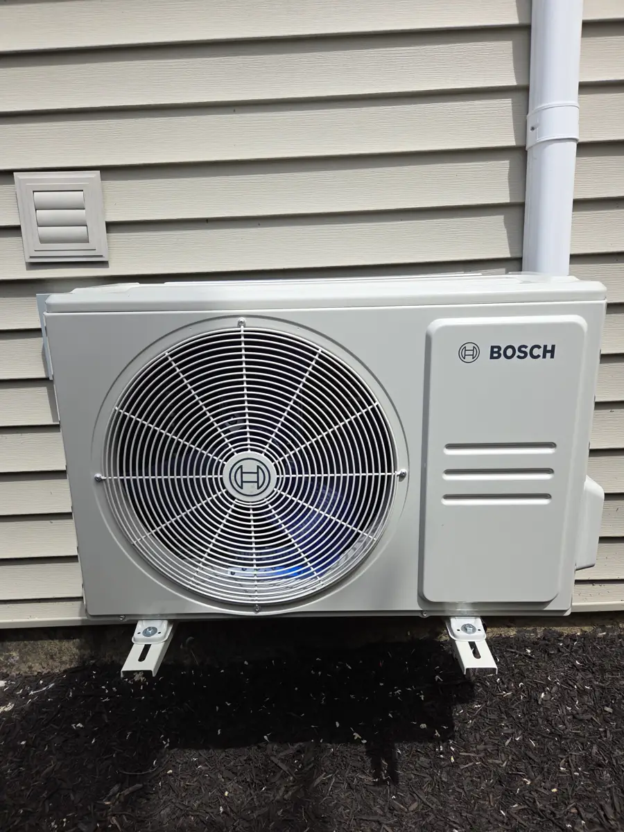 New Bosch ductless mini-split outdoor unit on wall brackets at a Glen Ellyn, IL home