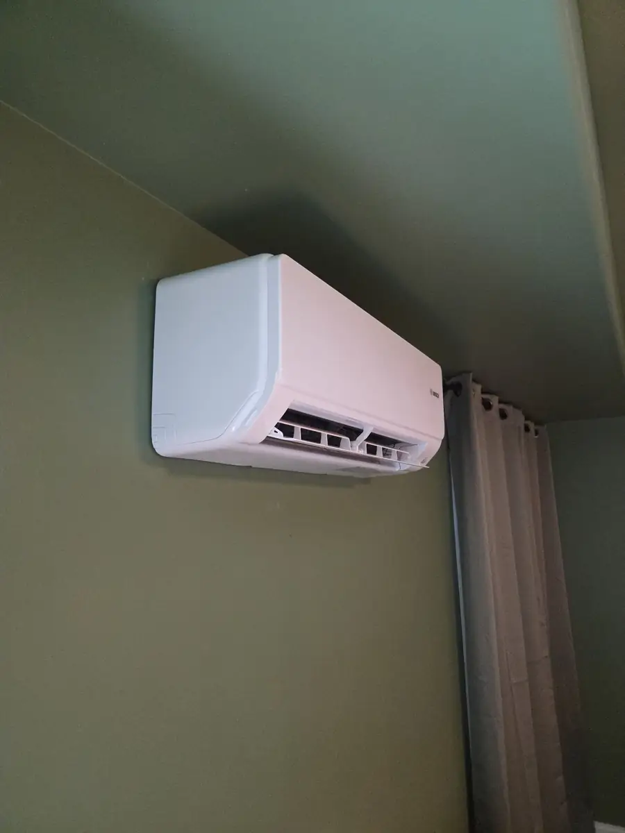 New Bosch ductless mini-split wall unit installed in a Glen Ellyn, IL bedroom