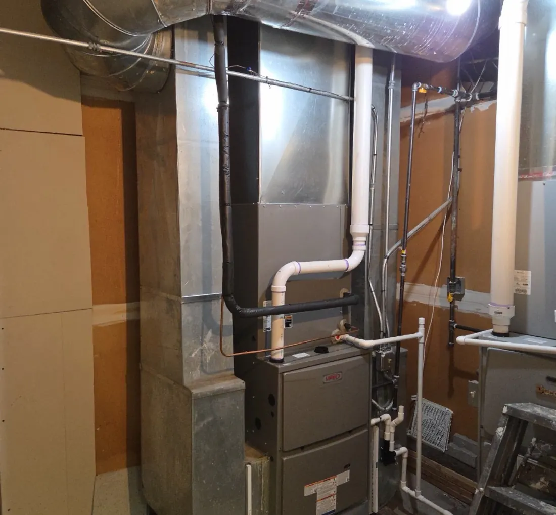 Finished furnace installation with a new ductwork trunk by Pure Comfort