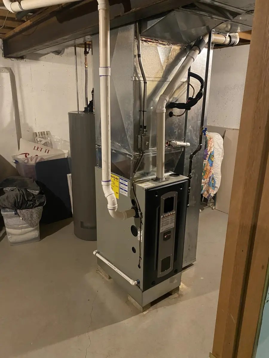 New high-efficiency furnace with PVC venting and new sheet metal in an Elgin, IL basement