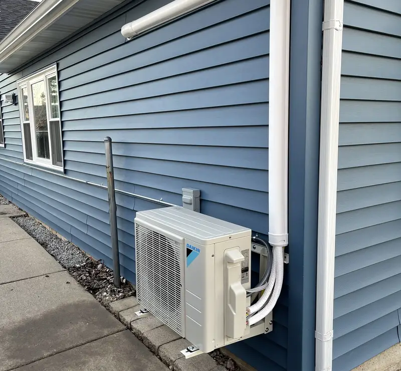 Daikin ductless mini-split outdoor unit with line-set cover in Inverness, IL
