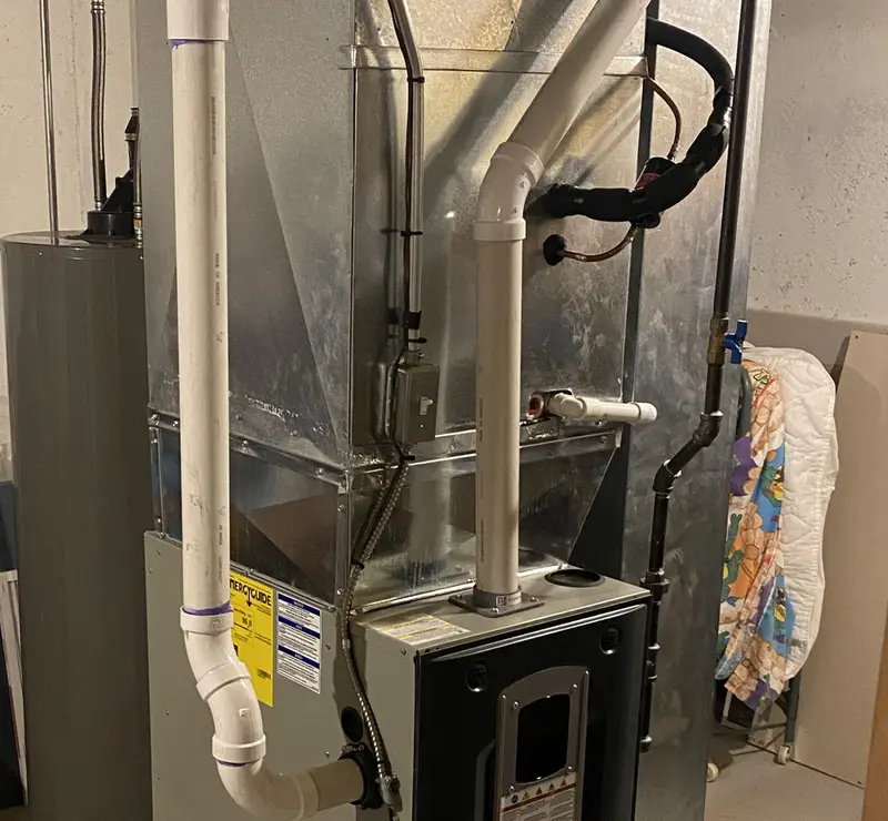 Trane high-efficiency furnace with PVC venting in an Inverness, IL basement
