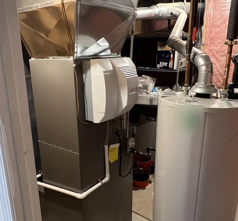 Furnace with whole-home humidifier installed in an Itasca, IL basement