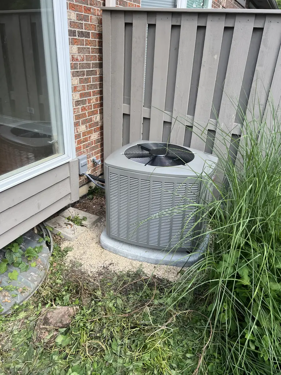 New Lennox air conditioner beside a brick townhome in Glen Ellyn, IL