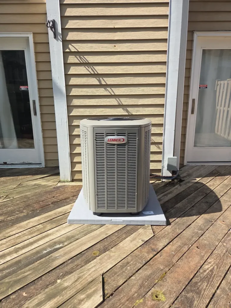 New Lennox air conditioner on a pad on a backyard deck in Streamwood, IL