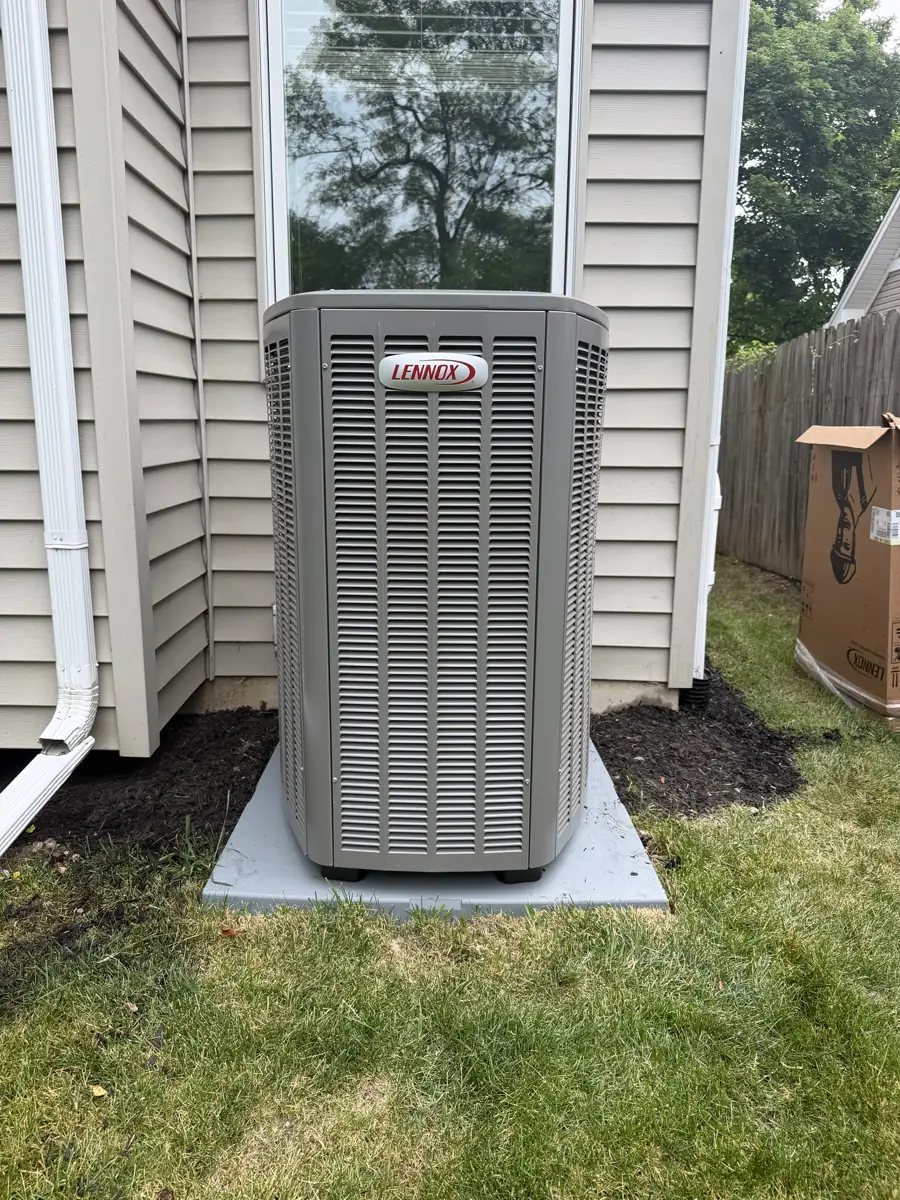 New Lennox air conditioner on a new pad at a Glen Ellyn, IL home