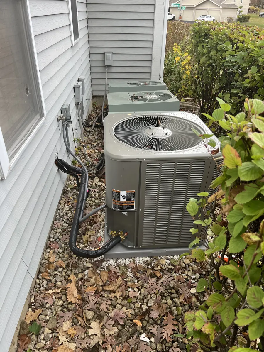 New Lennox air conditioner installed beside a townhome in Elgin, IL