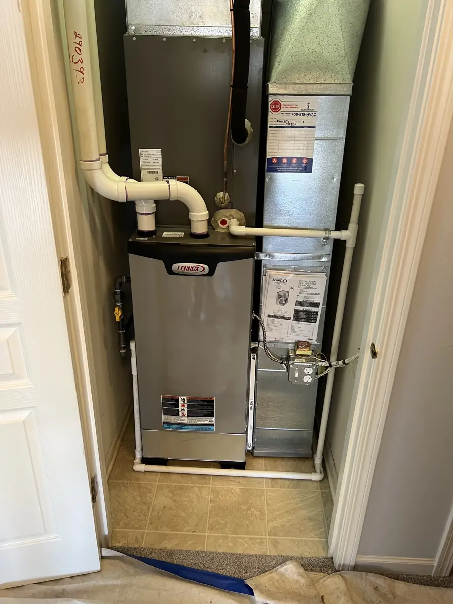 New Lennox Elite furnace and coil installed in a utility closet in Elgin, IL