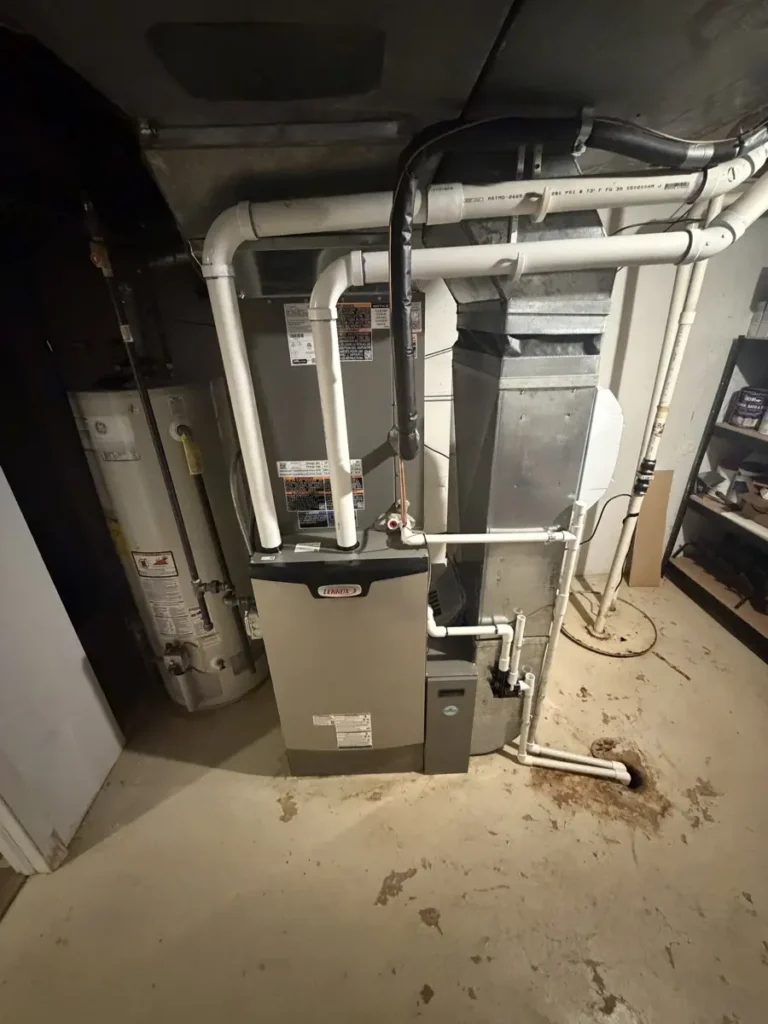 New Lennox high-efficiency furnace and coil with PVC venting in a Schaumburg, IL basement