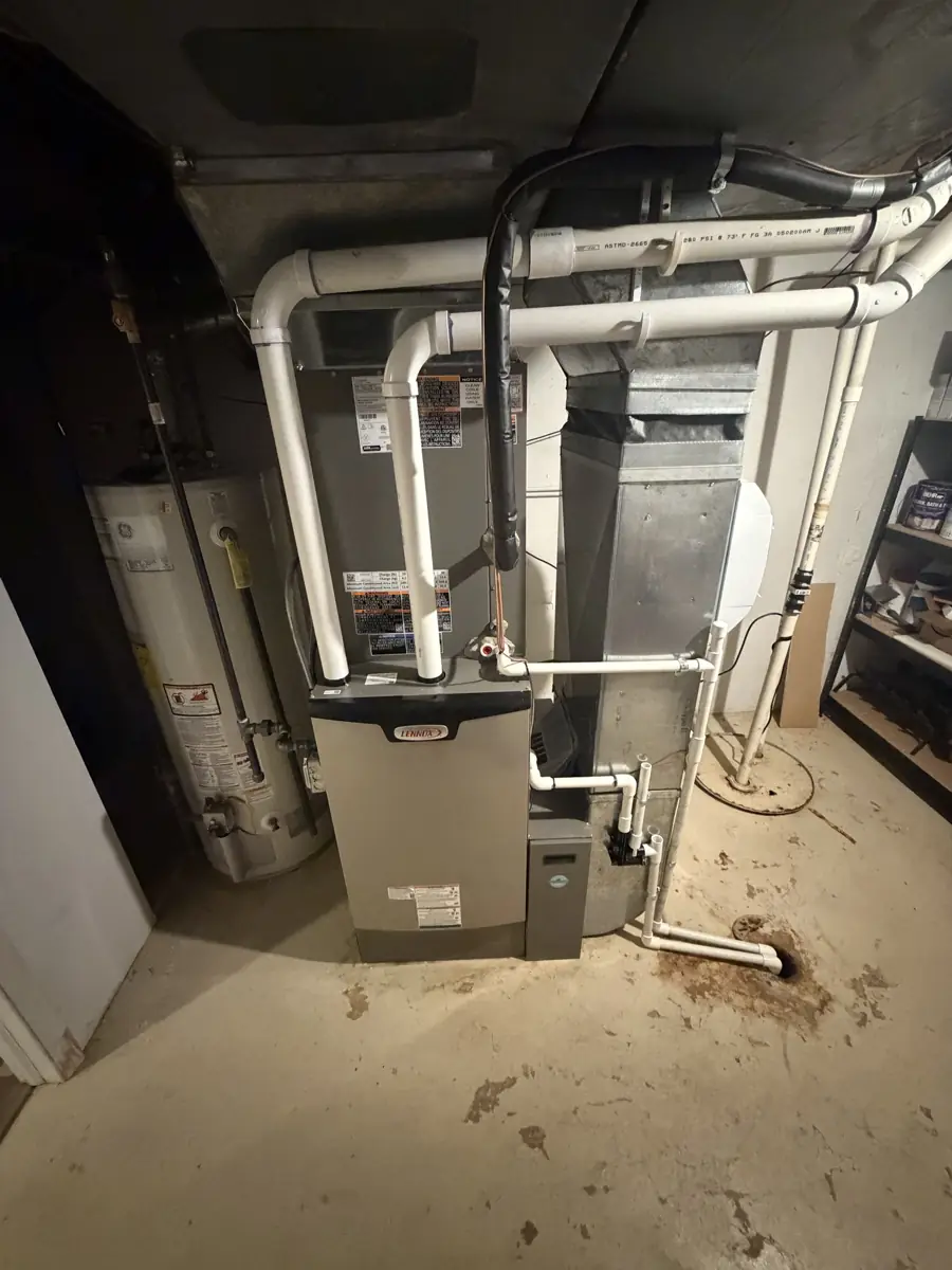 New Lennox high-efficiency furnace and coil with PVC venting in a Schaumburg, IL basement