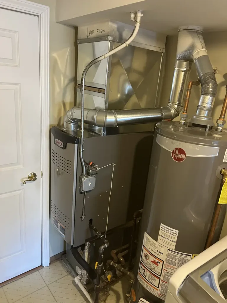 New Lennox furnace and sheet metal in a Schaumburg, IL laundry room