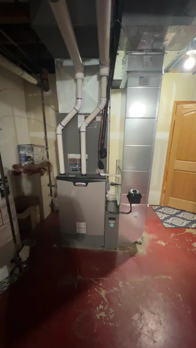 New Lennox high-efficiency furnace with new supply ductwork and PVC venting in an Elgin, IL basement