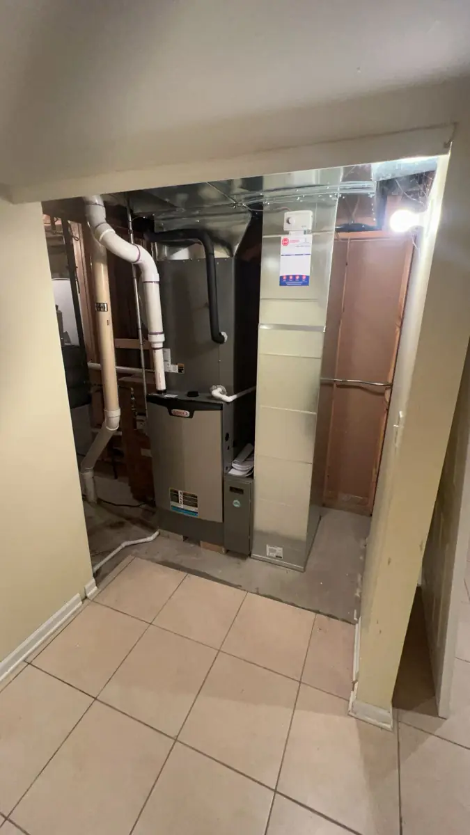 New Lennox furnace and sheet metal in a finished-basement utility room in Streamwood, IL