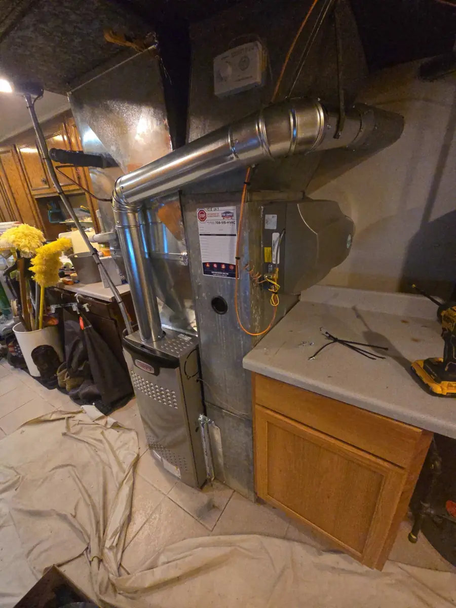 New Lennox furnace with new venting installed by Pure Comfort in a Streamwood, IL basement