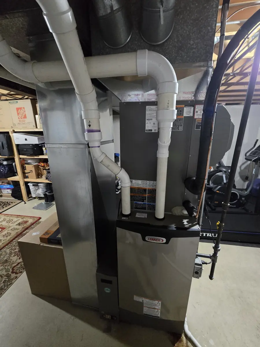 New Lennox high-efficiency furnace and R-454B coil with PVC venting in a Hoffman Estates, IL basement