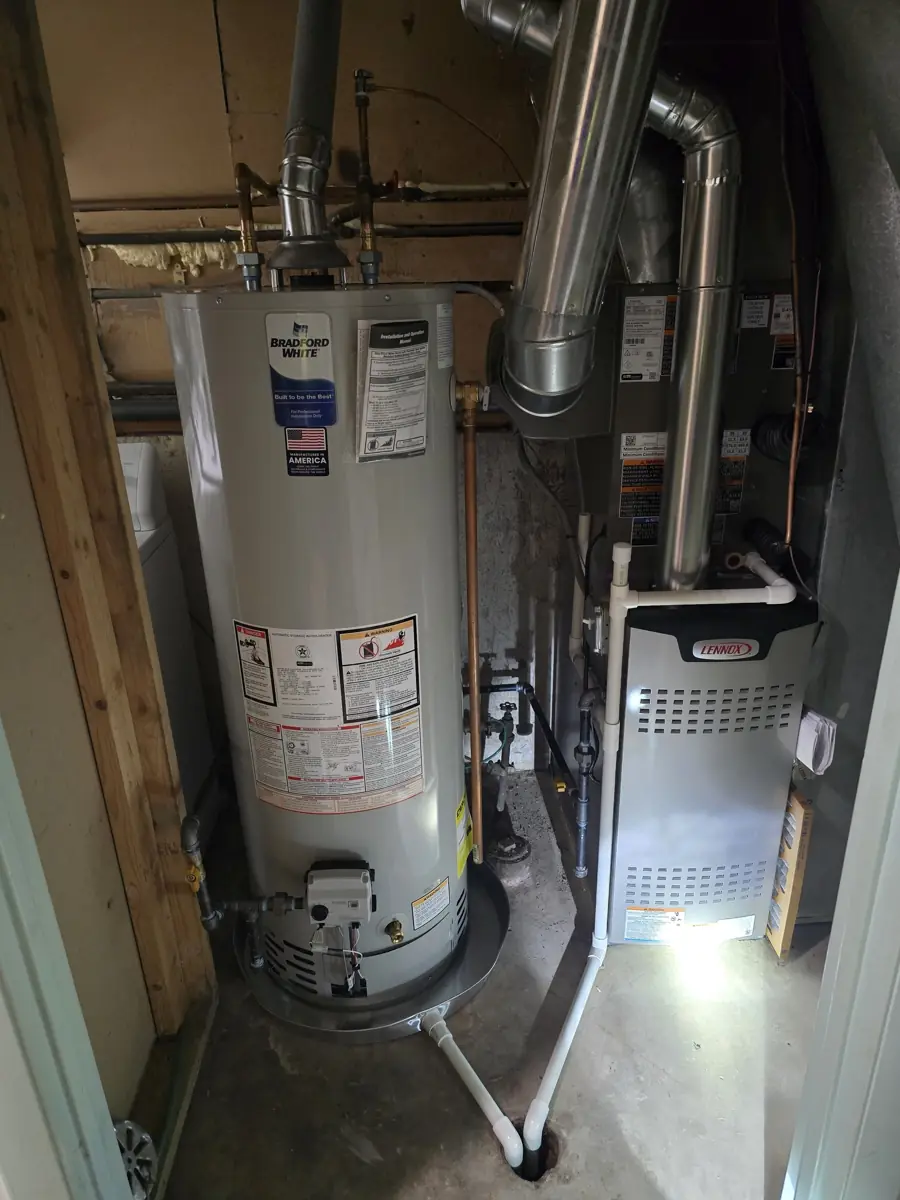 New Lennox furnace and Bradford White water heater installed by Pure Comfort in a Hanover Park, IL utility closet