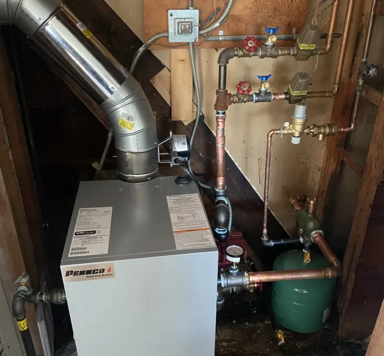 New Pennco cast-iron boiler with new piping and expansion tank installed by Pure Comfort