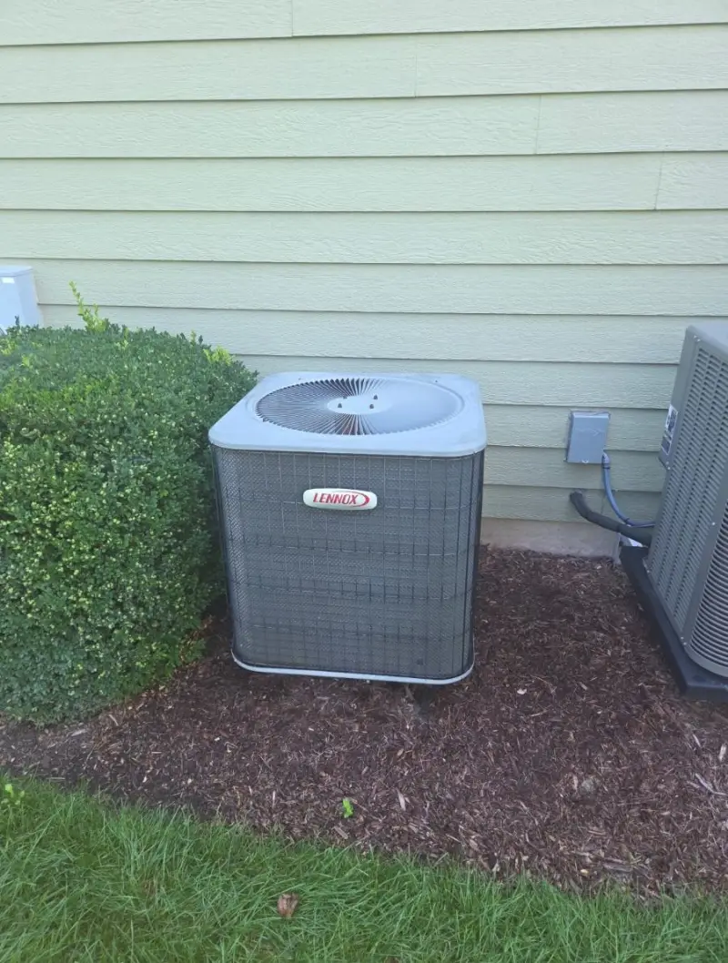 Older Lennox outdoor air conditioner before replacement in St. Charles, Illinois by Pure Comfort Heating & Cooling
