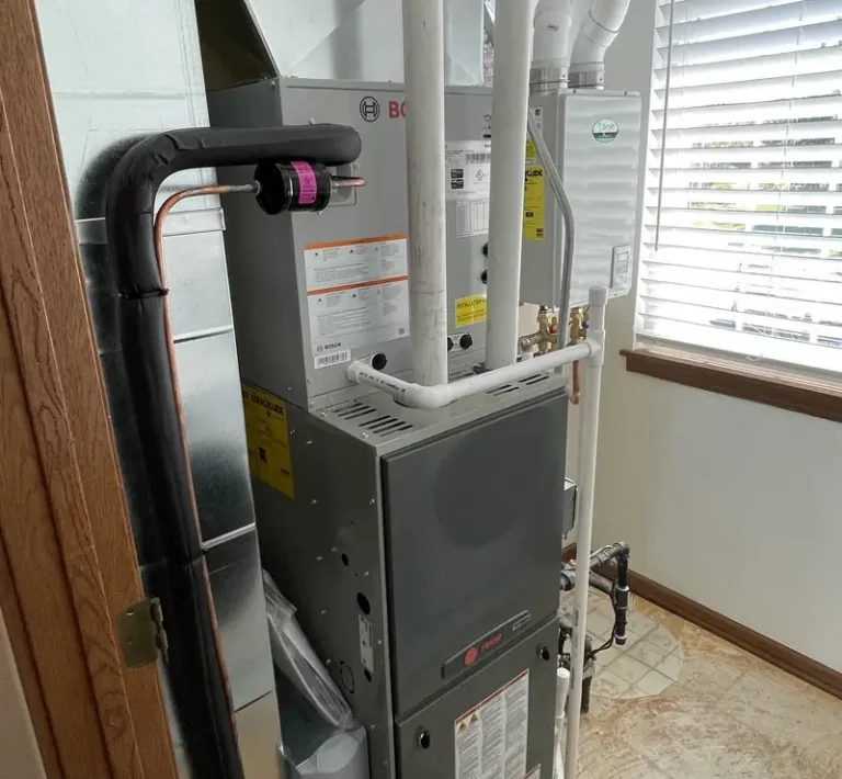 New Bosch AC coil and high-efficiency furnace installed by Pure Comfort in an Algonquin, IL utility room