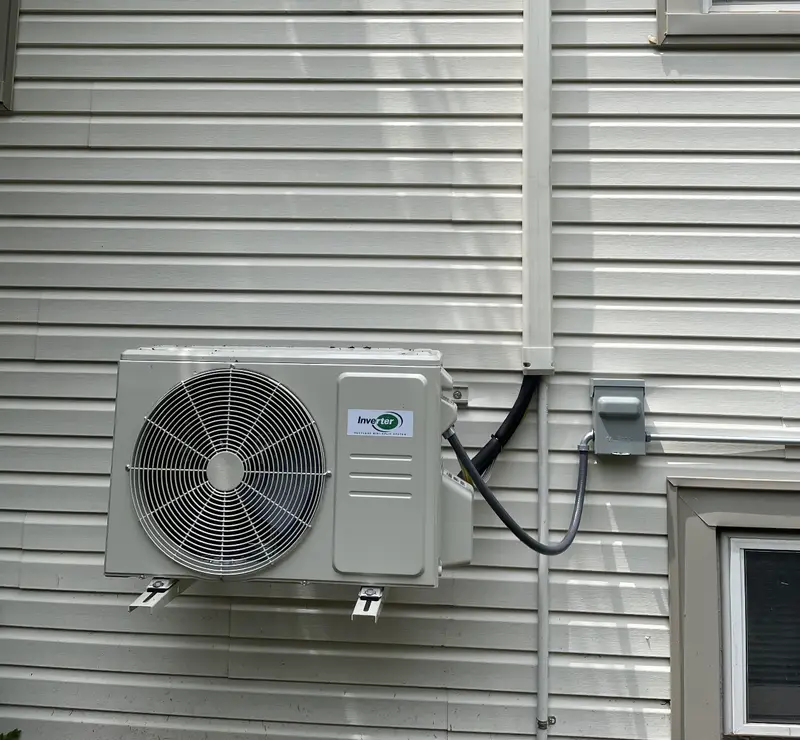 Wall-mounted ductless mini-split outdoor unit installed by Pure Comfort in Roselle, IL