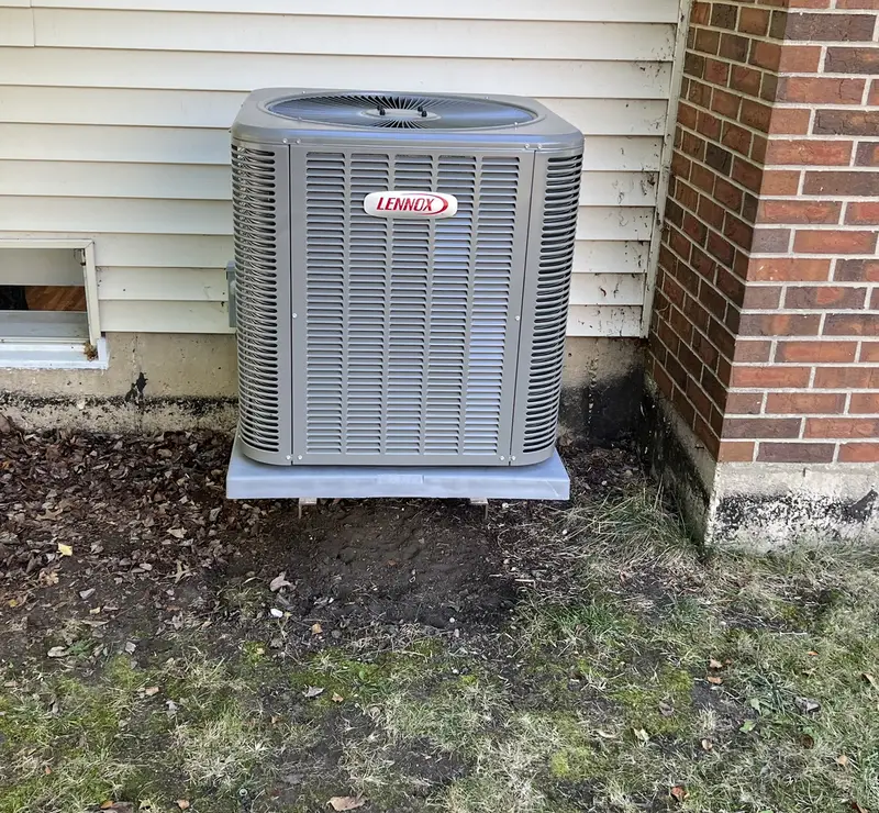 New Lennox air conditioner beside a brick and siding home in St. Charles, IL