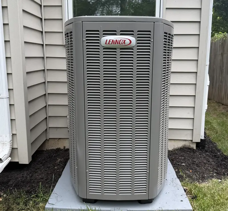 New Lennox air conditioner on a pad beside a Glen Ellyn, IL home