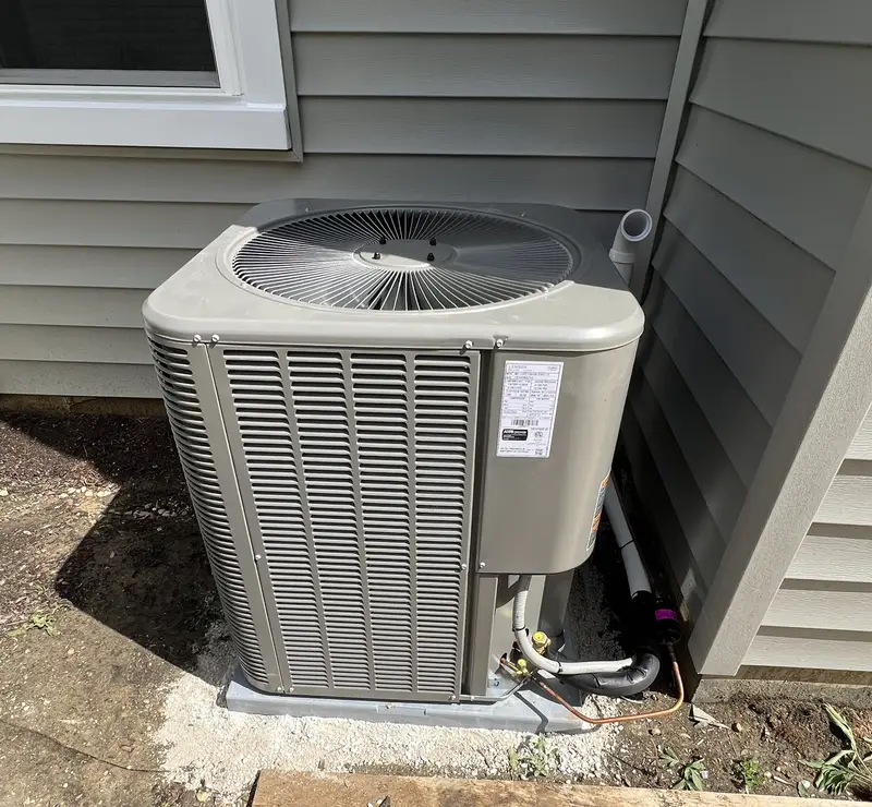 New Lennox air conditioner on a new pad installed by Pure Comfort in Elk Grove Village, IL