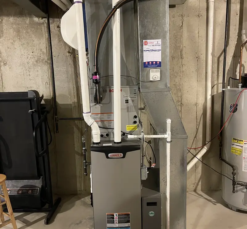 New Lennox Elite furnace and Bosch AC coil installed by Pure Comfort in a Wheaton, IL basement