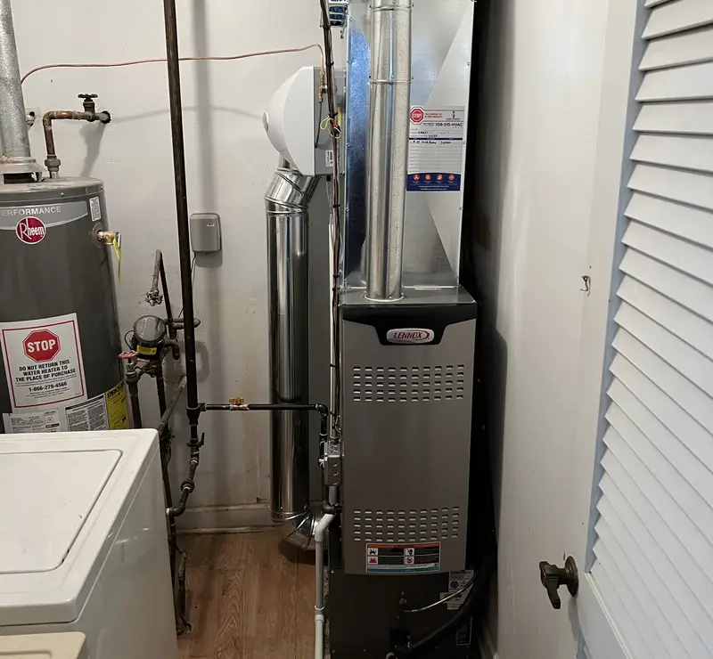 New Lennox furnace with humidifier installed by Pure Comfort in a Glendale Heights, IL laundry room