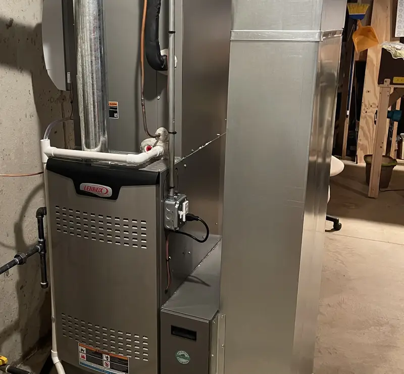 New Lennox furnace with media air cleaner installed by Pure Comfort in a St. Charles, IL basement